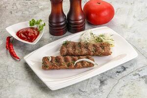 Kebab with beef served onion photo