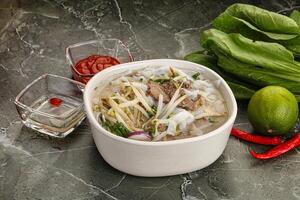 Vietnamese soup Pho Bo with beef photo