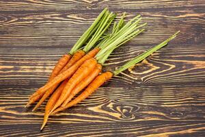 Young raw carrot heap isolated photo