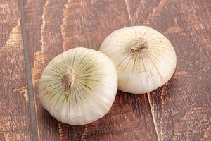 Raw white onion heap isolated photo