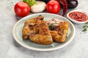 Grilled chicken wings with sauce photo