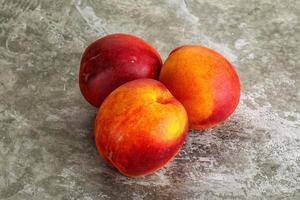 Ripe sweet juicy fresh red nectarines photo