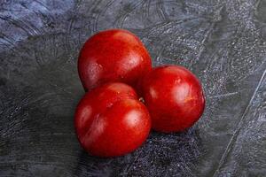 Ripe sweet juicy red plum photo