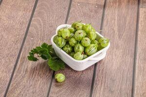 Sweet ripe gooseberries in the bowl photo