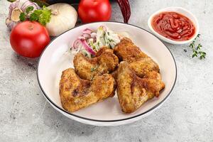 Grilled chicken wings with sauce photo