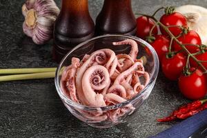 Delicous marinated squid tentacles in the bowl photo