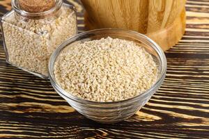 Sesame seeds heap in the bowl photo