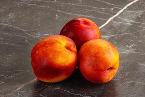 Ripe sweet juicy fresh red nectarines photo