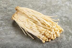 Tasty raw enoki mushroom heap photo