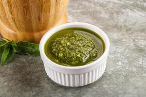 Homemade vegetarian basil pesto sauce photo