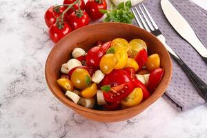 Italian Caprese salad with tomato and mozzarella photo