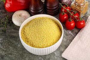 Raw dry wheat couscous grain photo