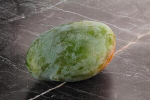 Ripe sweet green tropic mango photo