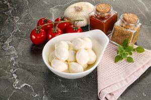 Mini mozarella cheese bolls heap photo