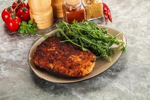 Tasty roasted breaded meat schnitzel photo