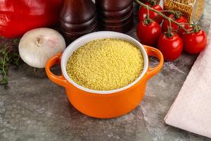 Raw dry wheat couscous grain photo