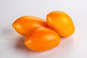 Ripe juicy yellow tomato heap photo