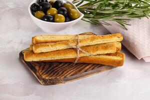 Crispy grissini italian bread heap photo