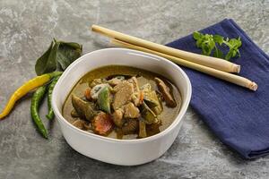 Thai green curry soup with basil photo