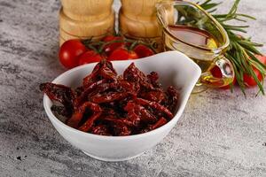 Homemade dry tomatoes with oil photo