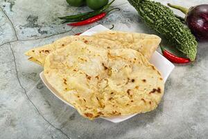 Indian tandori bread - naan with cheese photo