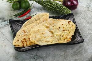 Indian tandori bread - naan with cheese photo