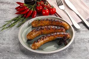 Grilled meat sausages with spices photo