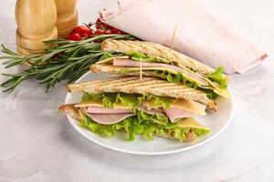 Homemade club sandwich with ham and cheese photo