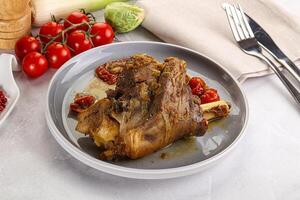 Baked Lamb shank with bone photo