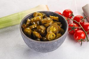 Sliced canned jalapeno pepper photo