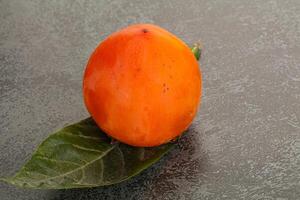 Fresh ripe sweet juicy persimmon photo