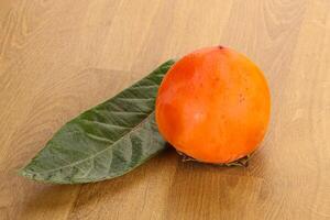 Fresh ripe sweet juicy persimmon photo