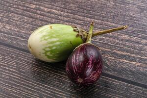 Heap of raw asian baby eggplant photo