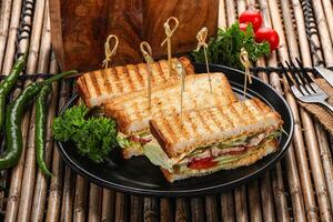 Club sandwich with chicken cheese and salad photo