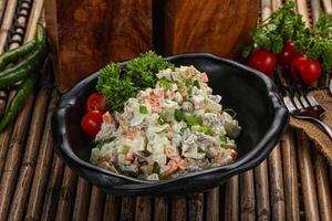 Traditional Russian salad with mayonnaise photo