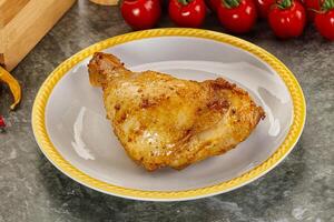 Roasted chicken leg with spices photo