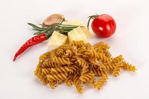 Raw whole grain pasta fusilli photo