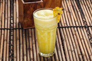 Sweet cold pineapple juice refreshment photo