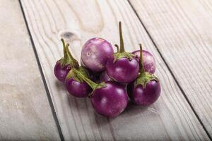 Raw small purple asian baby eggplant photo