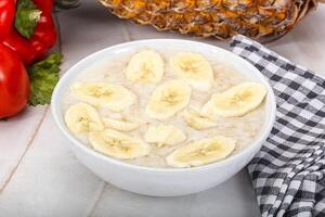Sweet porridge with banana breakfast photo