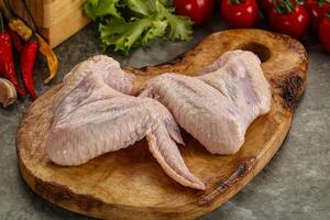 Raw chicken wings foe cooking photo