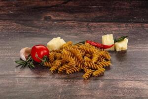 Raw whole grain pasta fusilli photo