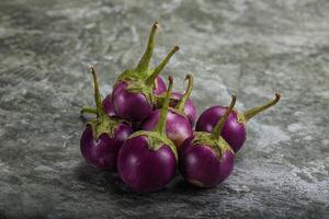 Raw small purple asian baby eggplant photo