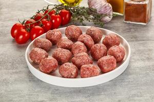 Uncooked raw beef meatball minced photo