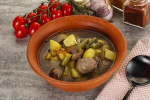 Soup with meatball and potato photo