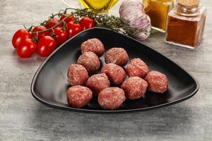 Uncooked raw beef meatball minced photo