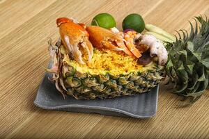 Rice with seafood in pineapple photo