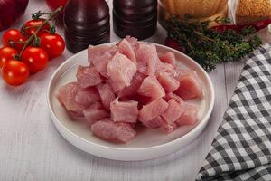 Diced raw turkey fillet cubes photo