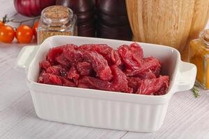 Raw beef meat - sliced strips photo