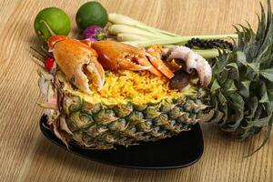 Rice with seafood in pineapple photo